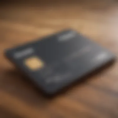 A close-up view of a credit card on a wooden table.