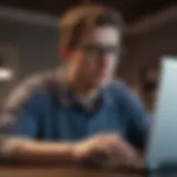 A close-up of a person typing on a laptop with a worried expression.